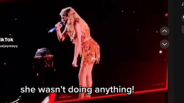 Screenshot from a TikTok video showing the moment Taylor Swift advocates for a fan's right to enjoy the concert during an off stage incident at the Philadelphia Eras Tour