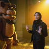 Kevin Foster as Freddy Fazbear with director Emma Tammi on set courtesy of Universal Pictures and Everett Collection