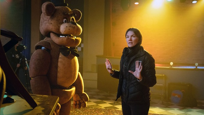 Kevin Foster as Freddy Fazbear with director Emma Tammi on set courtesy of Universal Pictures and Everett Collection