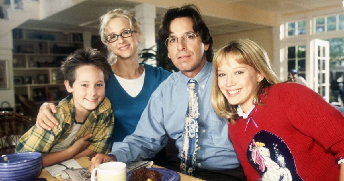 the mcguire family posing for a