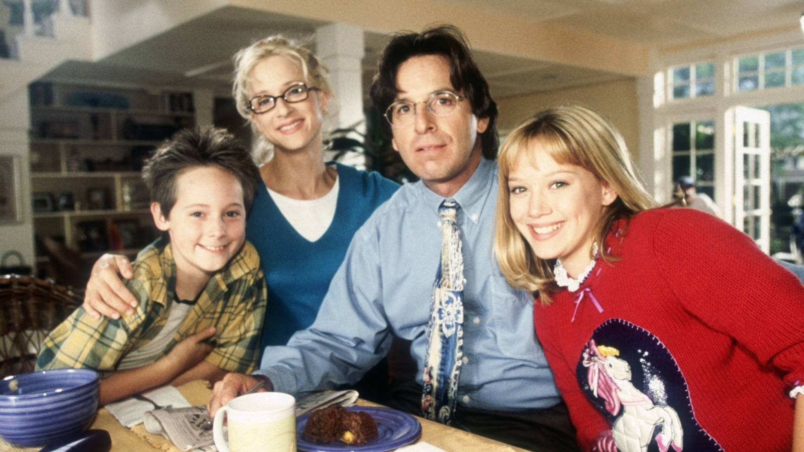 the mcguire family posing for a