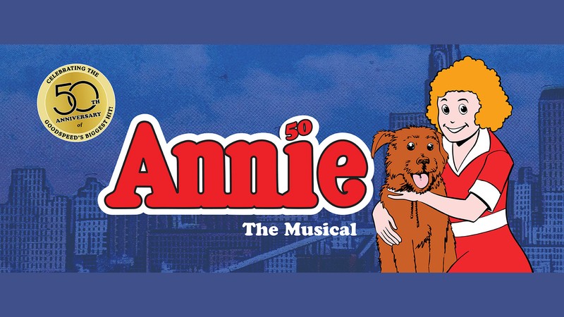 Official key art for Goodspeed Musicals' 50th anniversary production of Annie, showing the red Annie logo with the cartoon Annie hugging Sandy against a New York City skyline