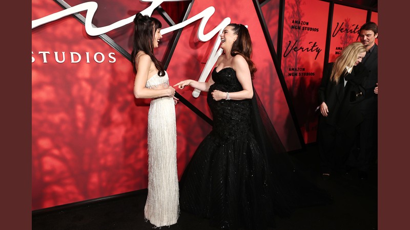 Anne Hathaway and Dakota Johnson on the red carpet at the Verity New York premiere at AMC Lincoln Square