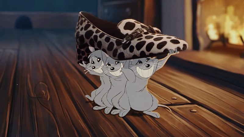 Three hand-drawn mice carry a shoe across a wooden floor in Prada's Drawing Prada holiday campaign
