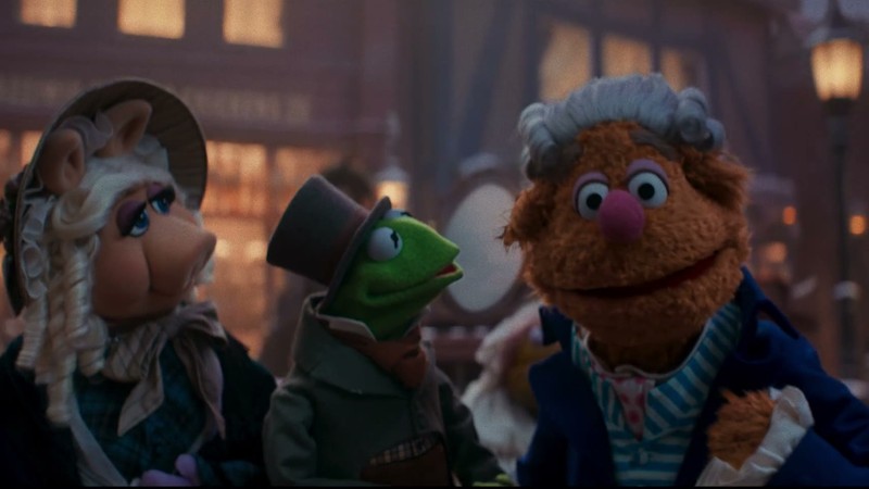 Miss Piggy as Emily Cratchit, Kermit the Frog as Bob Cratchit and Fozzie Bear in A Who Knew Carol
