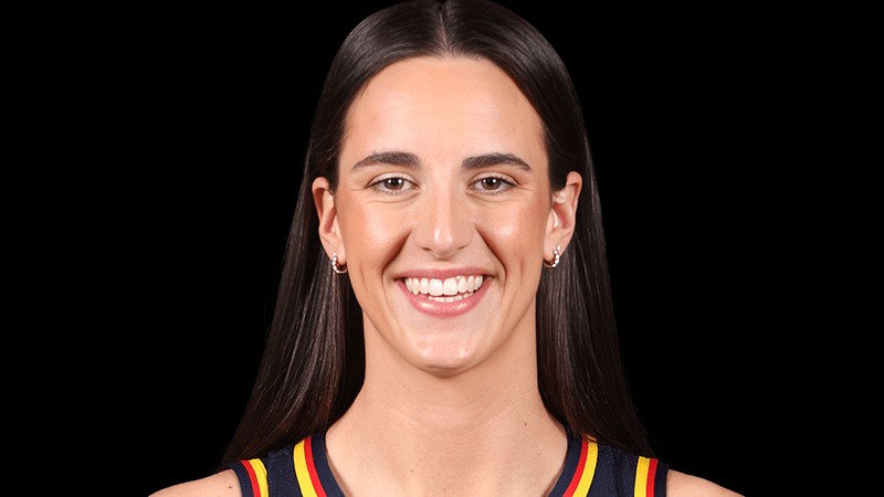 Caitlin Clark smiles in her Indiana Fever jersey in an official headshot