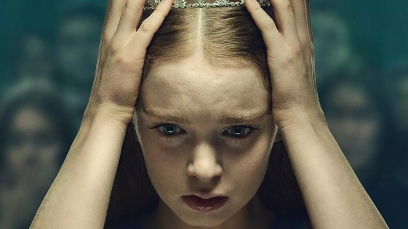 Summer H. Howell as Carrie White, hands pressed to her prom tiara, in Prime Video's Carrie